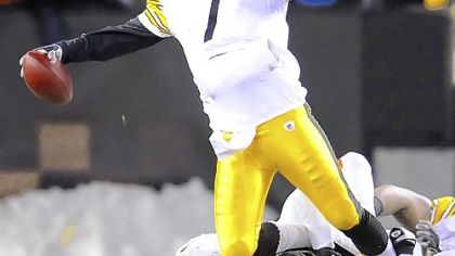 Ben Roethlisberger is sacked by the Browns linebacker Marcus Benard last night at Cleveland Browns Stadium.