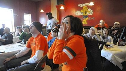 Browns fan Carrie Doyle, of Allegheny West but originally from Youngstown, Ohio, watches a Steelers scoring drive during the 10th annual indoor tailgate party of the Pittsburgh Browns Backers at Peter's Pub in Oakland yesterday.