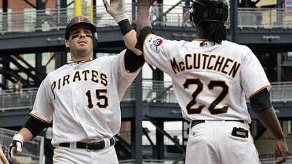 Pirates third baseman Andy LaRoche is greeted by teammate Andrew McCutchen who was on base for his two-run homer off Dodgers pitcher James McDonald during the eighth inning.