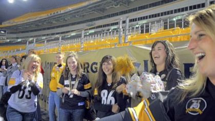 Some of the nearly 500 women attending last week's Ladies Night Out at Heinz Field cheer for their friends as they attempt field goal kicks.