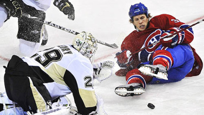 Canadiens forward Travis Moen slides in on Penguins goaltender Marc-Andre Fleury during the first period.