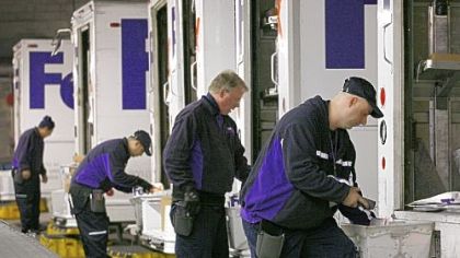 John Dionise, who drives for FedEx Home, at the company' North Side terminal.
Darcy Underwood and others on the slide sorter at the FedEx terminal on Neville Island each sort between 800 and 1,000 packages an hour.