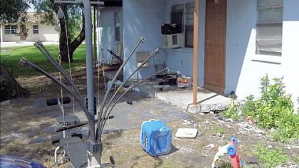 This rubbish-strewn house is where Santonio Holmes was raised in his early years, on what is known as "the alley" in the Okeechobee Center Project of Belle Glade, Fla. When drugs and danger visited that duplex, his mother moved the family to another part of the project.