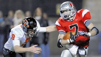 West Allegheny's Mike Caputo breaks away from Erie Cathedral Prep's Ricky Makowski last night at North Allegheny.
