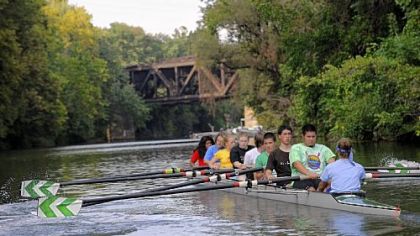 The Taylor Allerdice novice teams paddles along a channel of the Allegheny River during a Septemner practice in anticipation of the Head to the Ohio Festival.