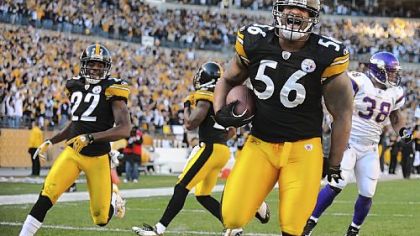 Steelers linebacker LaMarr Woodley picks up a loose ball and returns it for touchdown against the Minnesota Vikings.