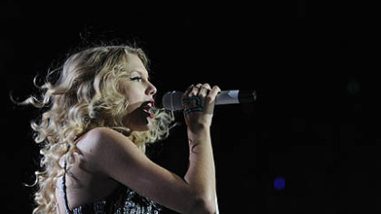 Taylor Swift belts out a song.