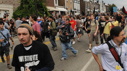 Protesters and media move down Liberty Avenue.