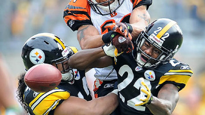 Steelers defensive backs Troy Polamalu and William Gay break up a pass intended for Bengals wide receiver Laveranues Coles.
