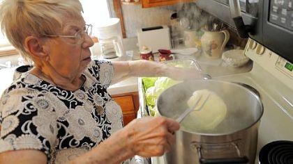 Josephine Gresko blanches the cabbage before stuffing it with the hamburger filling.