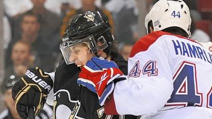 Evgeni Malkin is roughed up by the Canadiens' Roman Hamrik.