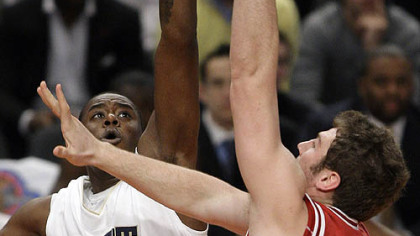 Indiana forward Tom Pritchard shoots against Pitt center Dante Taylor in the first half.