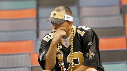 A New Orleans Saints fan mulls over his team's 24-17 loss to the Dallas Cowboys Saturday night. The Saints fell behind early, allowing touchdowns on the Cowboys' first two possessions, and couldn't recover from first-half mishaps.