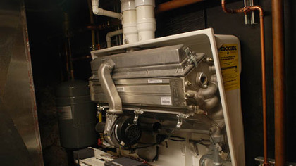 The house has been updated to meet high standards for energy use and design. The hot water boiler is in the basement.