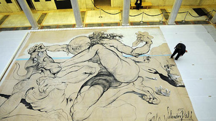 A Salvador Dali work; a 1942 curtain "Theseus Minotaur," for the Ballet Russe de Monte Carlo is inspected by Ellen Baxter, chief conservator at the Carnegie Museum of Art.