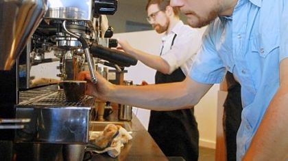 Andre Chubb of Highland Park pours an espresso shot during the soft-opening week of Tazza D'Oro inside CMU's Gates Center for Computer Science.