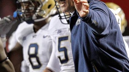 Dave Wannstedt works the sideline Friday night.