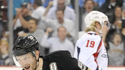 Sergei Gonchar, celebrating a goal in the playoffs last season, is more offensive-minded than linemate Brooks Orpik.