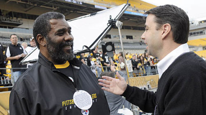 Former Steeler Joe Greene chats with Tommy Okon, who was featured in a commerical 30 years ago. They meet prior to the Sunday's game at Heinz Field.