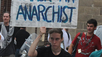 One young man offers his own feeling about protesters with his homemade sign.