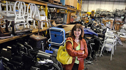 Kathleen Hower, executive director of Global Links, is surrounded by recent donations of medical equipment crowding the organization's warehouse in Homewood. "It's a nice problem to have," she said.