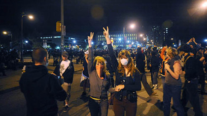 Riot police respond to a group of protesters gathered in Schenley Plaza.