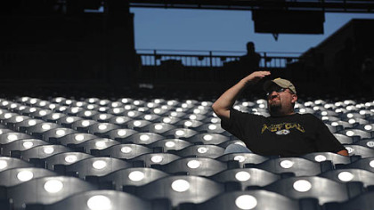 Shawn Gray of Canonsburg covers his eyes from the sun as he watches the Pirates beat the Dodgers, 11-1.
