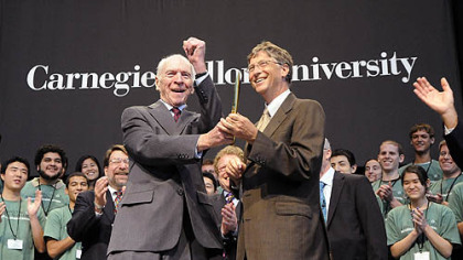 Henry Hillman, left, and Bill Gates celebrate the ribbon-cutting yesterday of the new Gates Center for Computer Science and the Hillman Center for Future-Generation Technologies at Carnegie Mellon University. The Bill & Melinda Gates Foundation donated $20 million and the Henry Hillman Foundation donated $10 million toward the $98.6 million project.
