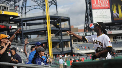 Pirates outfielder Andrew McCutchen throws a hat into the crowd after the Pirates beat the Dodgers.