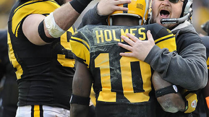 Steelers defensive end Brett Keisel and offensive coordinator Bruce Arians congratulate Steelers wide receiver Holmes after a touchdown reception in the second quarter of a 23-20 defeat of the Ravens.