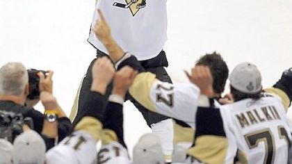 Sidney Crosby lifts the cup after defeating Detroit in game 7 of the Stanley Cup final Friday.