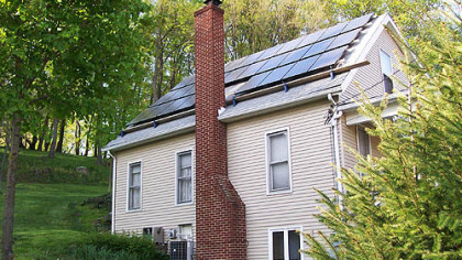 Twenty-eight solar panels of the Garlick home supply all of its electricity.