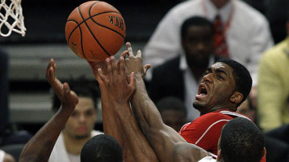 Indiana guard Maurice Creek goes up for a shot against Pitt forward Dante Taylor and guard Brad Wanamaker in the first half.