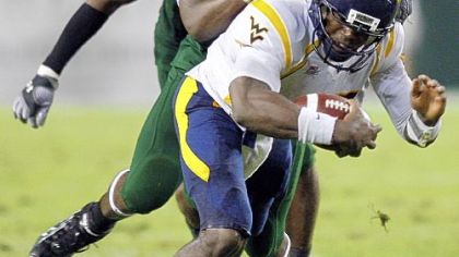 South Florida defensive end Craig Marshall, pulls down West Virginia quarterback Jarrett Brown.