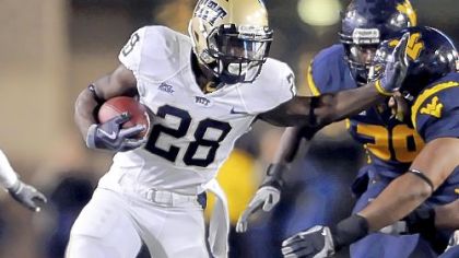 Pitt's Dion Lewis looks for running room against WVU in the first quarter. Lewis finished with 26 carries for 155 yards.