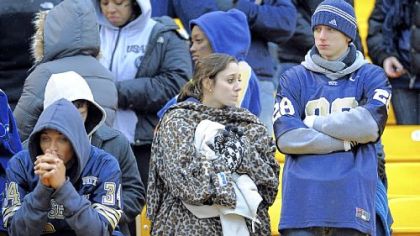 Pitt fans watch as Cincinnati players and fans celebrate the Big East championship Saturday at Heinz Field.