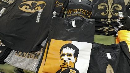 A T-shirt shop on Magazine Street in New Orleans is finding it dificult to keep Saints-themed shirts such as "Datman" and "What Would Breesus Do'' on its shelves.