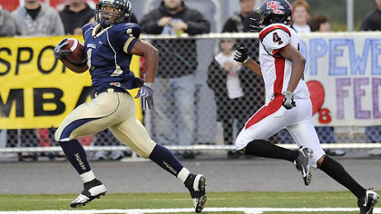 Hopewell's Rushel Shell runs the opening kickoff for a touchdown as he's chased by New Castle's Raysean Glenn last night.