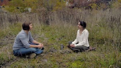 Juliette Jones, left, and Michelle Czolba sit at the site of the proposed Pittsburgh Food Forest on Second Avenue in Hazelwood. The two are planning to grow trees, shrubs and perennial herbs to help feed the community with fresh food.