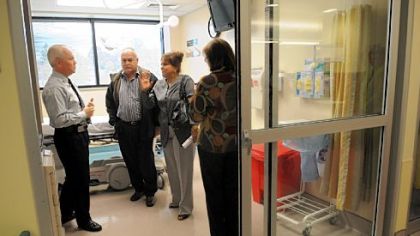 David Kish, left, executive director of emergency services and patient logistics at St. Clair Hospital, shows an emergency treatment room to Cuban physicians Dr. Luis Orlando Rodriguez and Dr. Carmen Cuba. Mimi Falbo, right, is from Global Links, which organized the visit.