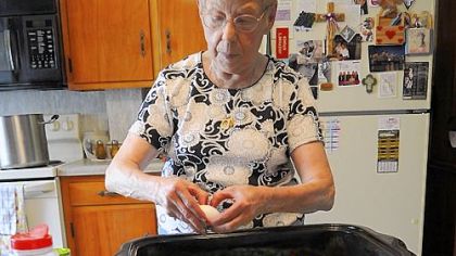 Josephine Gresko, the Cabbage Roll Lady, lines up the cabbages as she makes the hamburger filling for her famous cabbage rolls at her home in Carmichaels.