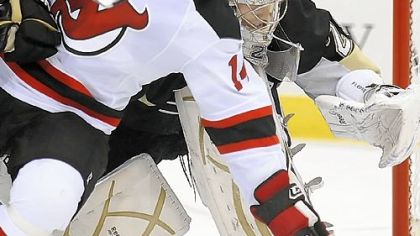 The Devils' Tim Sestito collides with Penguins goalie Marc-Andre Fleury in the second period last night at Mellon Arena.
