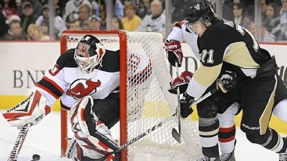 Martin Brodeur makes save against Evgeni Malkin en route to his record-setting 104th shutout.