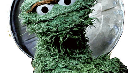 Elmo stops and smells the flowers.