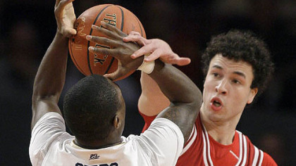 Indiana guard Jeremiah Rivers fouls Pitt guard Ashton Gibbs as he shoots in the first half.