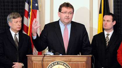 Duquesne Light's Morgan O''Brien, center, flanked by Pitt Chancellor Mark Nordenberg, left, and Pittsburgh Mayor Luke Ravenstahl, comments on the city's agreement with non-profits.