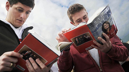 Andrew Hoover, left, and Ben Pollock, both of the South Side, read passages from Sarah Palin's book, "Going Rogue: An American Life" before a book signing at Sam.'s Club in South Strabane