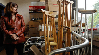 Kathleen Hower, Executive Director of Global Links, with donated medical supplies in their offices in Pittsburgh's Garfield neighborhood.
