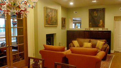 The liviing room includes a pass-through to the kitchen. At upper left is a Venetian glass chandelier.