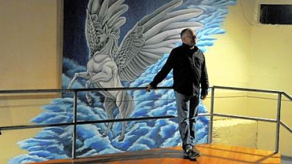 Scott Noxon, near a mural of Pegasus, first visited the bar in 1984, and bought it in 2005.